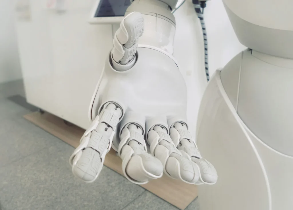 White humanoid robot with an open hand